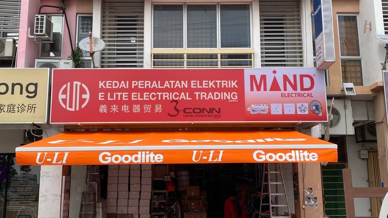 A motorised retractable awning extended over a shopfront.